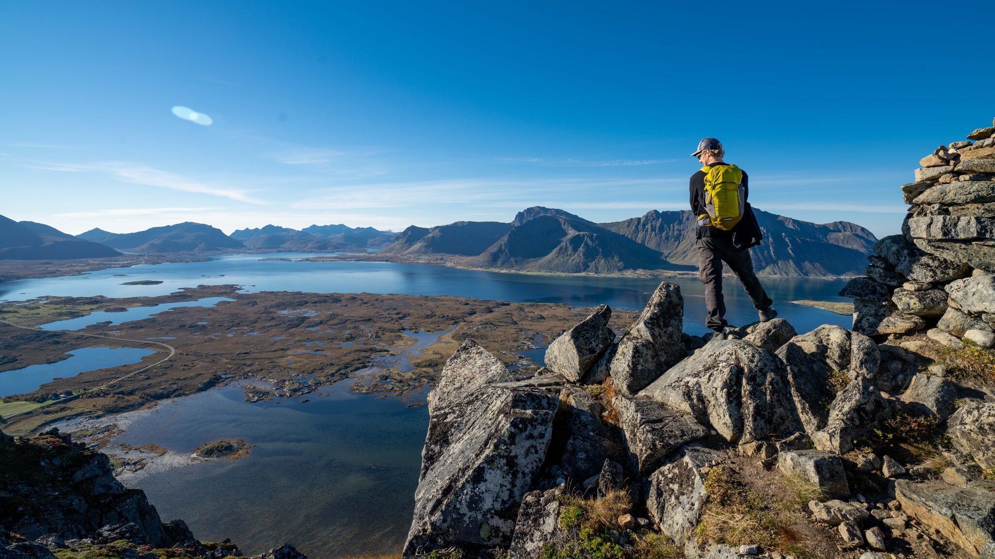 Man on a mountain in Lofoten